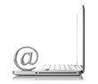 At symbol paper weight with laptop computer