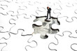 Puzzle, 100 dollar bill, and business figure