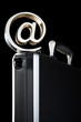At symbol paperweight on a briefcase