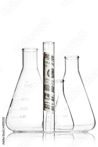 Photo: Test tube with 100 dollar bills and flasks Test tube with 100 dollar bills and flasks