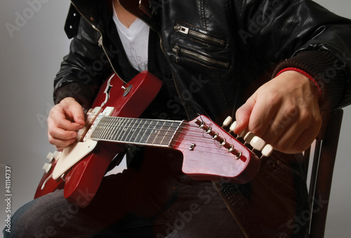 Photo: Playing the guitar Playing the guitar