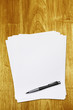 blank paper and pen on desk