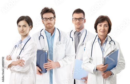 Photo: Group portrait of doctors on white background Group portrait of doctors on white background