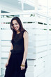 portrait of a beautiful brunette woman in a black dress. portrait of a beautiful brunette woman in a black dress.