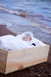 washed up baby in wooden box