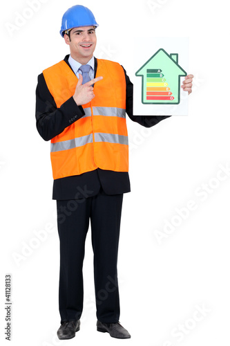 Photo: Man with helmet pointing at energy rating Man with helmet pointing at energy rating