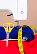 Sewing machine, accesories and colorful fabric Sewing machine, accesories and colorful fabric