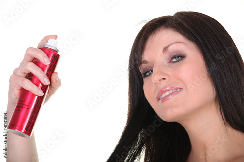 Photo: Woman with spray deodorant Woman with spray deodorant