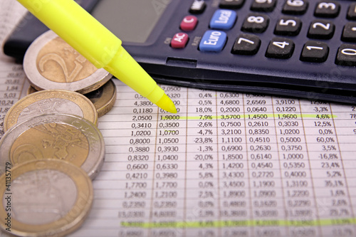 Photo: checking stock market figures checking stock market figures