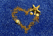 Golden sand heart with sea star