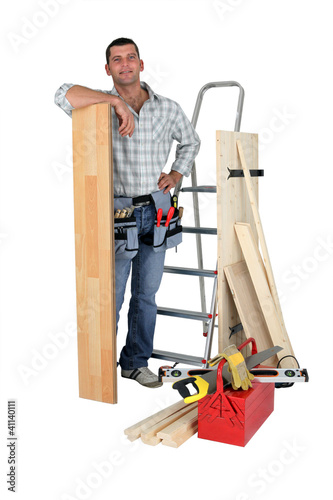 Photo: Carpenter with floorboards Carpenter with floorboards
