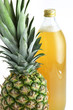 Pineapple and a bottle of juice Pineapple and a bottle of juice