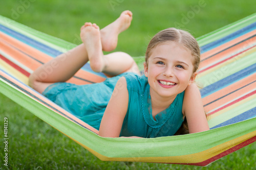 Foto: Lovely girl in colorful hammock Lovely girl in colorful hammock