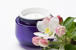 canvas print picture - Cosmetic moisturizing cream for face skin with flower
