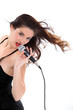 Brunette singing into microphone