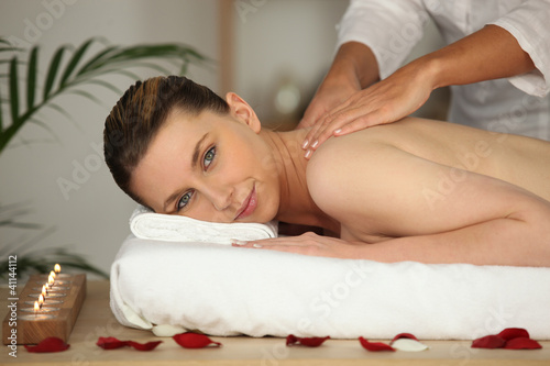 Photo: Woman receiving back massage Woman receiving back massage