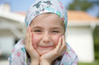 Little girl wearing a bandanna
