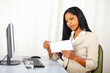 Executive woman opening a letter