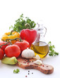 Olive oil, tomatoes, peppers and herbs on a white background Olive oil, tomatoes, peppers and herbs on a white background