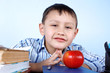 schoolboy with red apple and books schoolboy with red apple and books