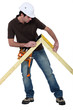 Man measuring truss