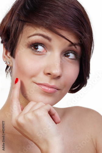 Photo: Beautiful teenage girl is thinking and looking up. Beautiful teenage girl is thinking and looking up.