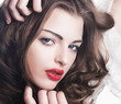 Closeup beautiful brunette woman face with sexy red lips