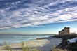 old castle by the sea with a beautiful sky
