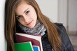 Shy young brunette student girl.