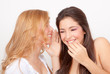 Photo: teens whispering and gossiping teens whispering and gossiping
