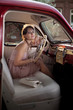 Woman in the vintage car