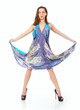 An beautiful young and slim woman standing in a short blue dress An beautiful young and slim woman standing in a short blue dress