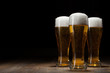 canvas print picture - three glass beer on wooden table with copyspace