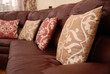 pillows on a leather sofa