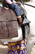 Detail of a little girl riding a horse on a spanish saddle