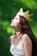 beautiful young woman wearing crown