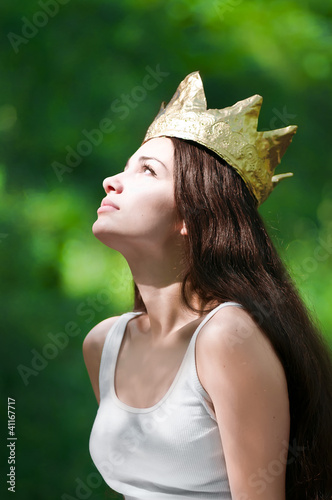 Photo: beautiful young woman wearing crown beautiful young woman wearing crown