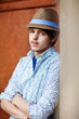 portrait of a young handsome man in a hat . portrait of a young handsome man in a hat .