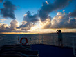 woman taking picture of sunrise