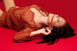 Photo: brunette lying on the floor brunette lying on the floor
