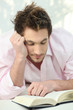 Young man reading a book