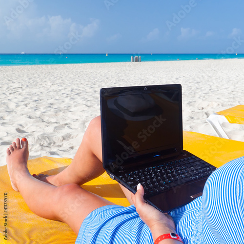 Photo: Relaxation with laptop on holiday at the Caribbean sea Relaxation with laptop on holiday at the Caribbean sea