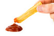 French fry being dipped in ketchup