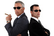 Powerful businessmen in sunglasses