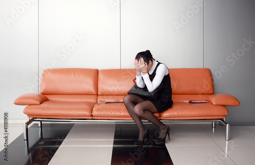 Photo: Downsizing, sad business woman Downsizing, sad business woman