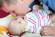 lucky young father with breast child