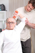 Older woman working out with a personal trainer