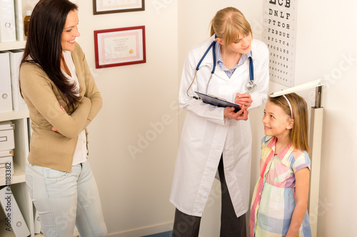 Photo: Medical check-up at pediatrist girl measure height Medical check-up at pediatrist girl measure height