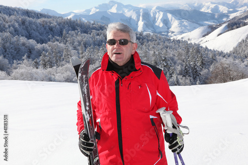 Photo: Middle aged staying fit by skiing Middle aged staying fit by skiing