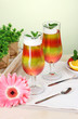 fruit jelly in glasses and fruits on table in cafe fruit jelly in glasses and fruits on table in cafe